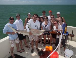 One of the school groups with Shiffman's team on the boat, after watching a blacktip shark. The pump in the shark's mouth helps it breathe when out of the water. 