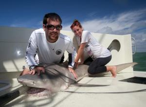 David Shiffman, 27, poses with a lemon shark in the Everglades National Park.