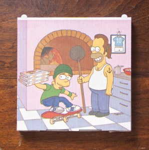 One of Weiner’s favorite pizza boxes, from a pizzeria in Amsterdam, features artwork of Homer and Bart Simpson.
